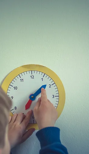 Child Interacting with Clock